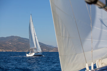 Obraz premium Sailboats during sailing regatta in the Sea. Luxery yachts.