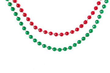 Obraz premium red and green beads on a white background