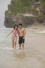 Couple walking on beach