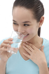 Young woman holding a glass of water