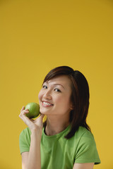 Fototapeta na wymiar Young Woman holding apple