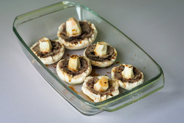 raw mushrooms in glass on the table