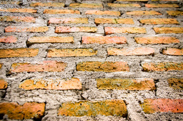 Old brick wall in a background with shadow of the lights