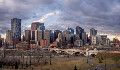 Calgary's skyline at sunrise along the Bow River.