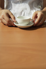 Girl with toy tea cup