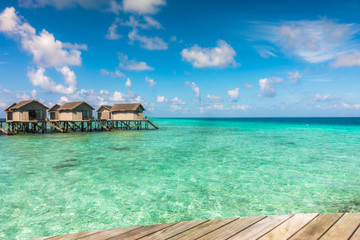 Beautiful tropical Maldives resort hotel with beach and blue wat