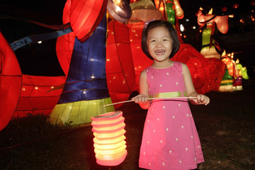 Little girl holding Chinese lantern