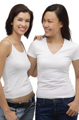 Two young women standing together and smiling