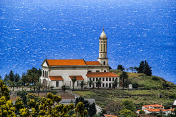Church high on a point above the sea near Funchal , Madeira, Por