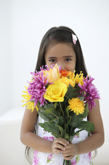 A young girl with a bunch of flowers