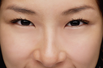 A close-up of a young woman looking at the camera