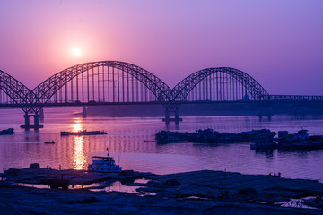Fototapeta na wymiar Yadanarbon bridge at sunset over Ayeyarwady River