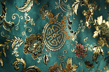 Detail of jade green Chinese silk fabric