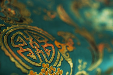 Detail of jade green Chinese silk fabric