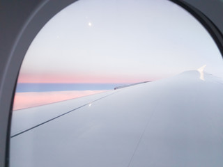 Sky view through airplane window.
