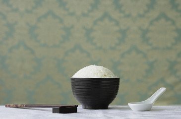 Bowl of rice with chopsticks