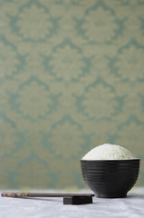 Bowl of rice with chopsticks