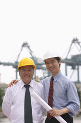 Men with helmets looking at camera