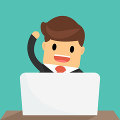 Happy  businessman working on computer