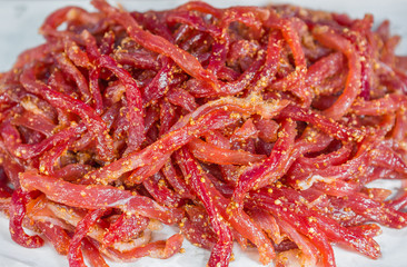 Pork mixed with spices under sunlight to make food tasty