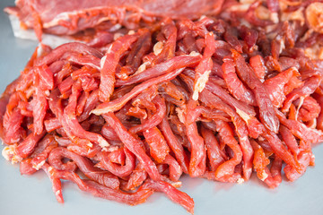 Pork mixed with spices under sunlight to make food tasty
