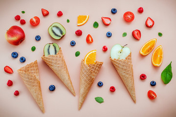Cones and colorful various fruits raspberry ,blueberry ,strawber