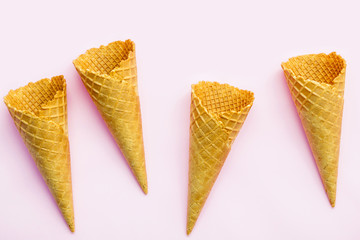 Flat lay ice cream cones collection on pink  background . Blank