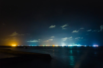 Abstract blur of Skyline  Male, Maldives at night with dark sea