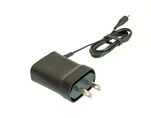 Small charging adapter for device shot on white isolated.