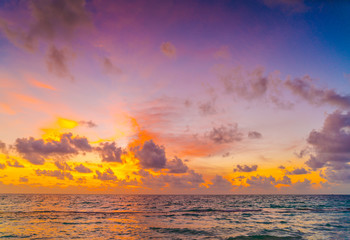 Fototapeta premium Beautiful sunset with sky over calm sea in tropical Maldives is
