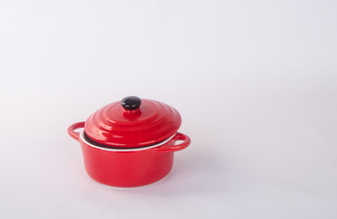 pot or red pot with cover on background.