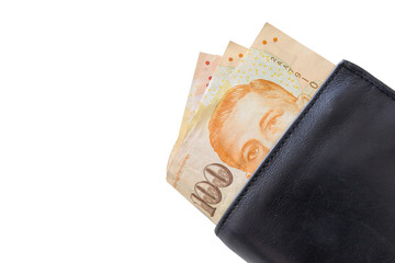 Singapore Dollars in a black wallet isolated on white background. clipping path