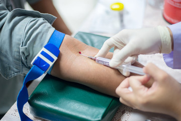 Nurse taking a blood sample for test the health