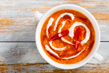spicy colorful Thai Pumpkin Soup in white cup