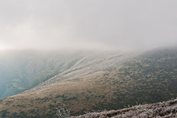 Landscape of the frost mountain with fog