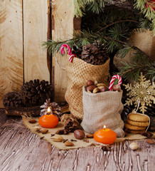 New Year or Christmas composition with walnuts, mulled wine, hazelnuts