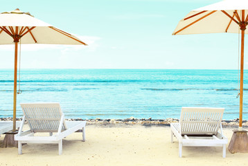 Beach chairs on exotic tropical white sandy 