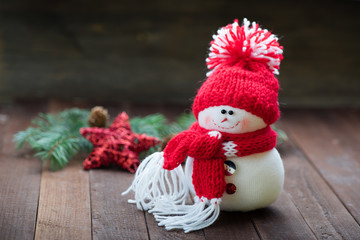 Snowman on wooden table. Christmas decoration. Copy space.