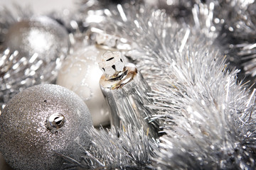 Brilliant  baubles like christmas decoration. Balls on silver background.