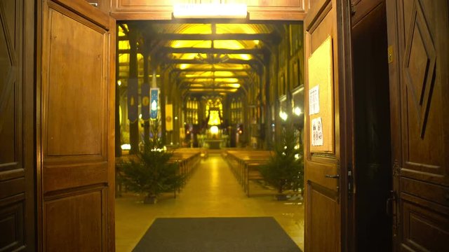 Open doors of beautiful and cozy cathedral inviting parishioners, religion