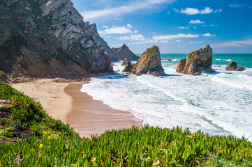 Cliffs and rocks on the Atlantic ocean coast - Praia da Ursa beach, Portugal