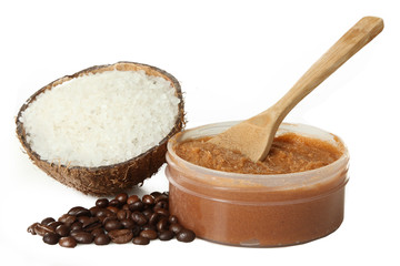 Body scrub of ground coffee, sugar and coconut oil in jar on white isolated background, homemade cosmetic for peeling and spa care