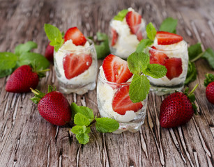 Strawberries with cream or tiramisu . selective focus