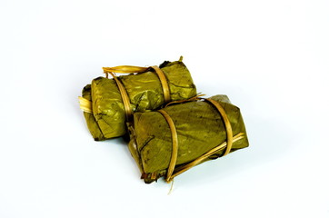 Porridge tie. Sticky rice wrapped in banana leaves, banana banana filling, steamed cooked food.
