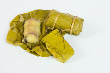 Porridge tie. Sticky rice wrapped in banana leaves, banana banana filling, steamed cooked food.

