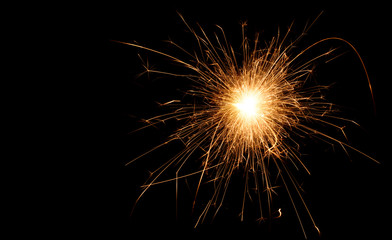 Fototapeta premium Christmas and new year party sparkler on black