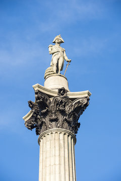Statue of Admiral Horatio Nelson standing atop the landmark Nelson's Column in the center of Trafalgar Square in London, England, UK