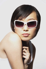 woman wearing over sized sunglasses