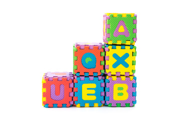 blocks made by alphabet jigsaw puzzle on white