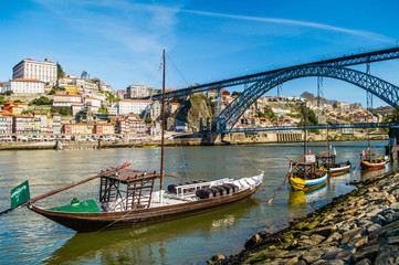 Old Porto cityscape skyline, traditional boats with wine barrels and Douro River in Porto, Portugal